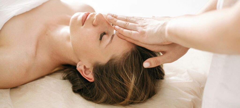 Woman enjoying a relaxing spa treatment at an all-inclusive luxury resort.