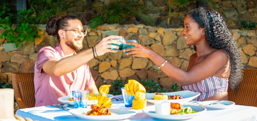 Young Couple celebrating over a meal at a Caribbean resort