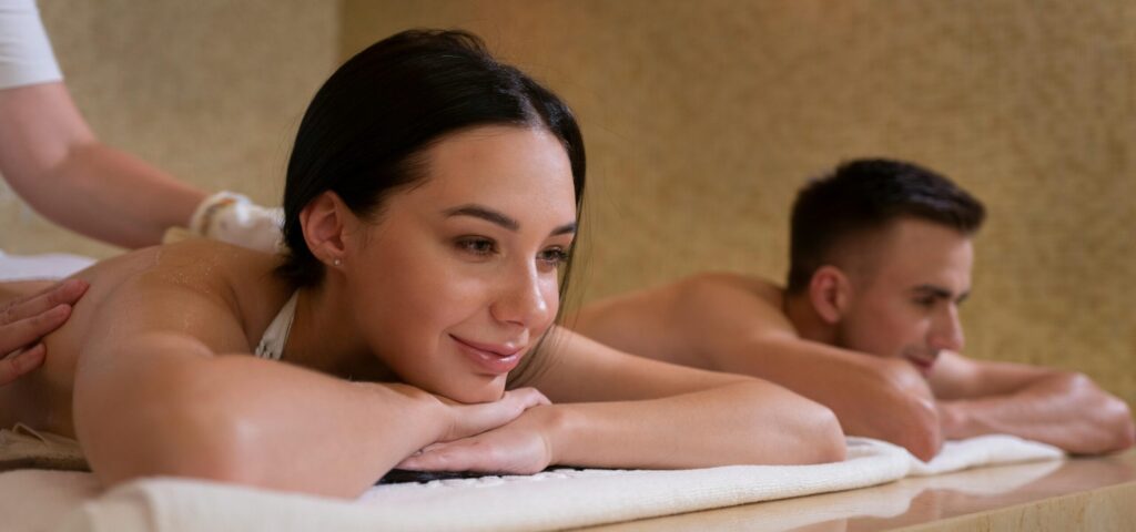 a happy young couple enjoying a spa visit at a luxury hotel